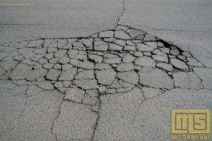 Here is an example of alligatored or deteriorated cracks in the asphalt. We do not fill this type of crack as the product will not adhere properly,